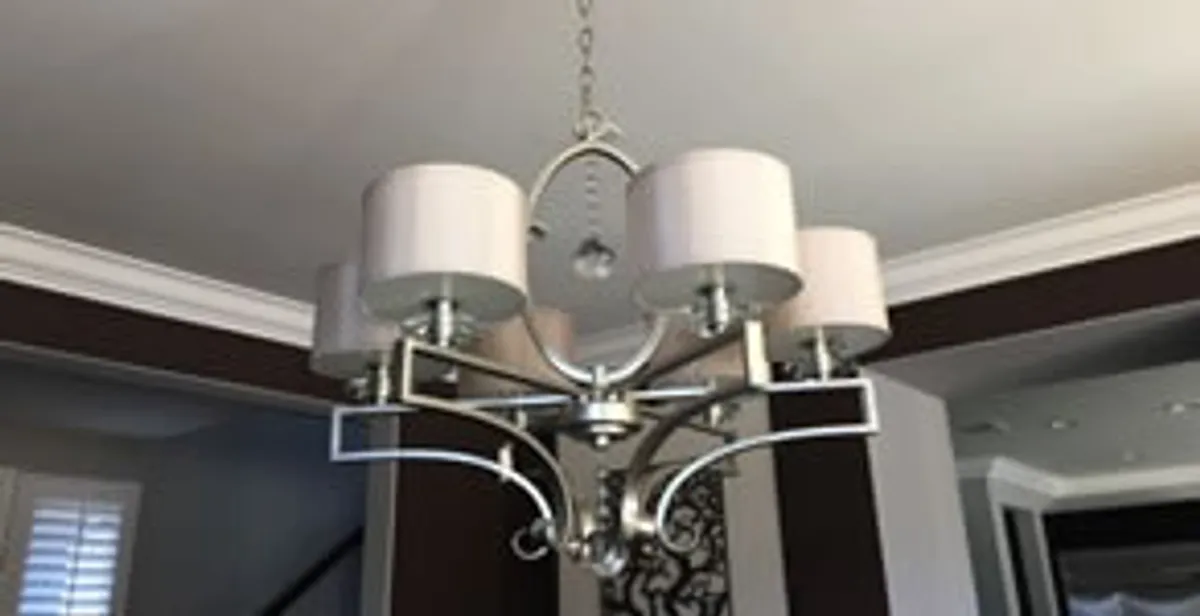Modern chandelier installation with multiple light fixtures in Savannah, GA